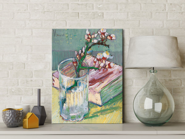 Blossoming Almond Branch in a Glass with a Book by Vincent Van Gogh
